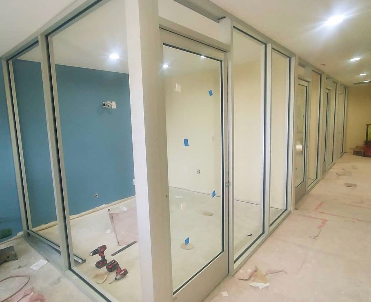 Glass office partition system in New York City workspace