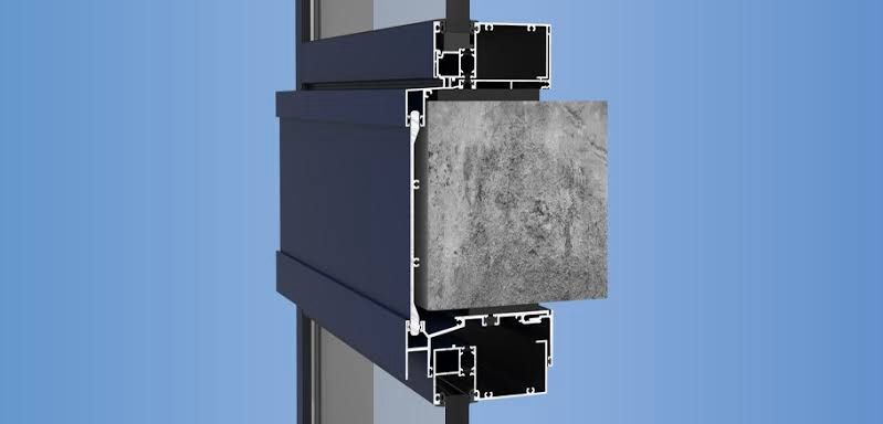 Curtain wall system cross-section showing framing, anchorage, and spandrel integration with the facade